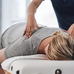 Chiropractic Calgary AB Woman Receiving Adjustment